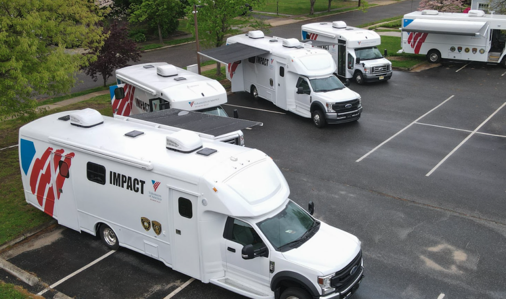 An aerial shot of five mobile IMPACT units. 
